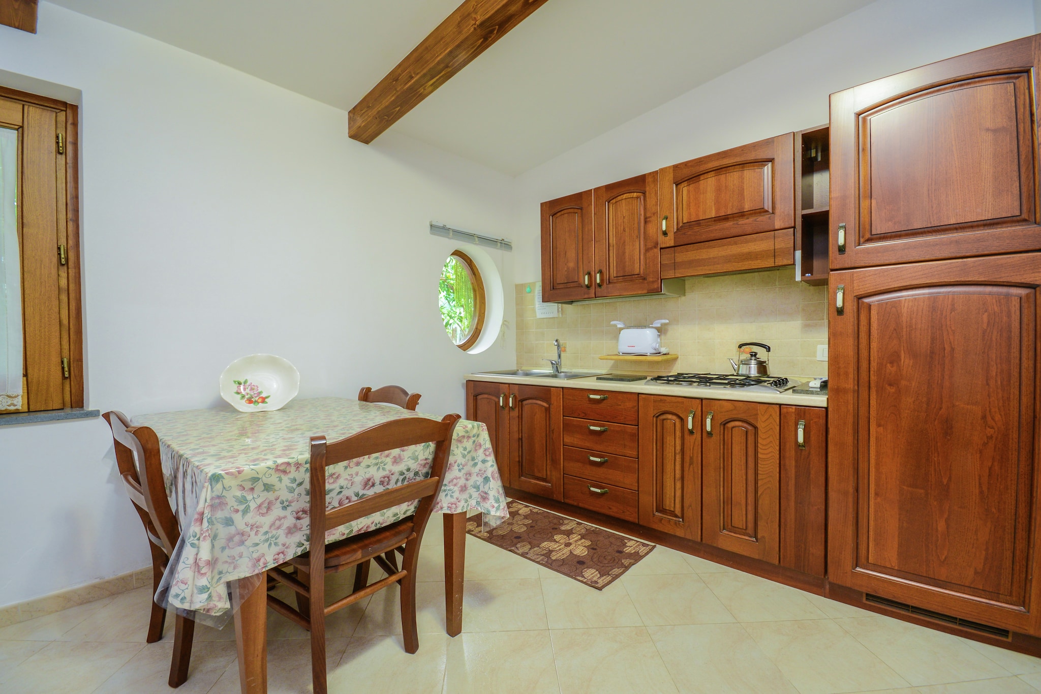 Located in Sorrento, this charming mansion features 1 bedroom for 3 people. Ideal for a group of friends or a couple, guests can lounge in the shared garden and access free WiFi here.
You can walk down to the town center, 1000 m away, where you can enjoy the local nightlife and explore restaurants. You can also go hiking in the forest nearby, 1000 m away. If you wish to spend a day sunbathing on the beach, you can drive down 1.5 km.
The living room is designed in a minimalistic style and its doors lead to a lush green garden where you can enjoy a scrumptious meal under the parasol. The kitchen is equipped with all amenities. Heating as well as air conditioning facility is also available here. A washing machine is also featured.
Public transport is available 1000 m away. The nearest airport is located 50 km away.