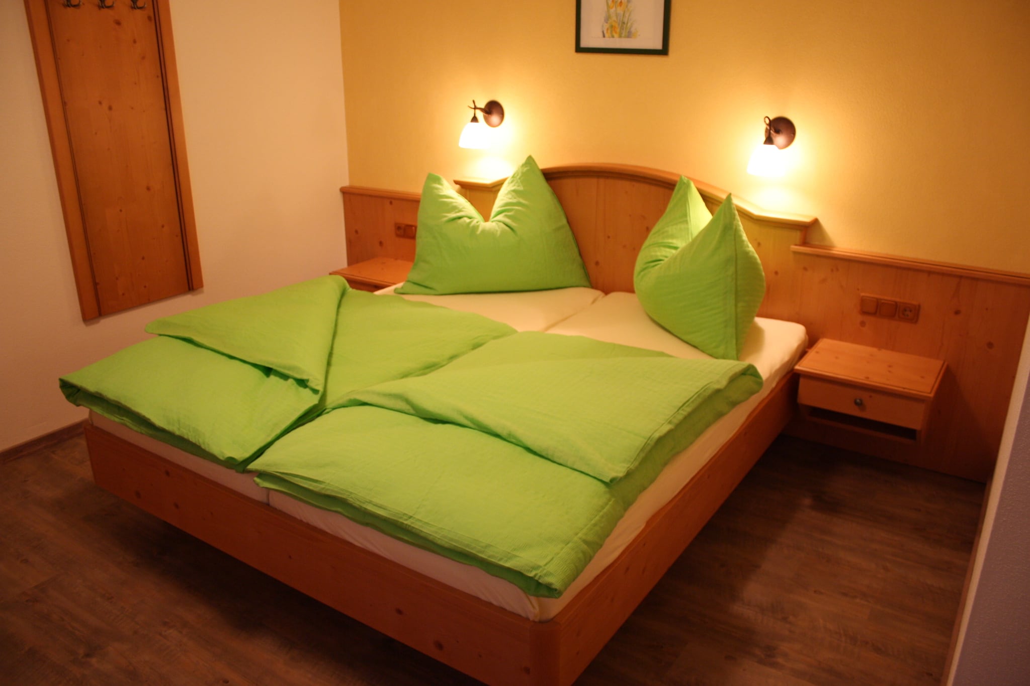 Ground floor: (hallway, Living room(double sofa bed, TV), open kitchen(dining table, electric kettle, cooker, coffee machine, oven, fridge-freezer), bedroom(single bed, double bed), bedroom(single bed, double bed), bathroom(bath tub, shower, washbasin, toilet), toilet)\n\nBasement: (relaxation area(shared with other guests)(shower, infrared sauna(paid), sauna(paid), toilet), ski storage, ski boot heaters)\n\nheating(floor heating), terrace, garden, garden furniture, parking, play equipment, table tennis table