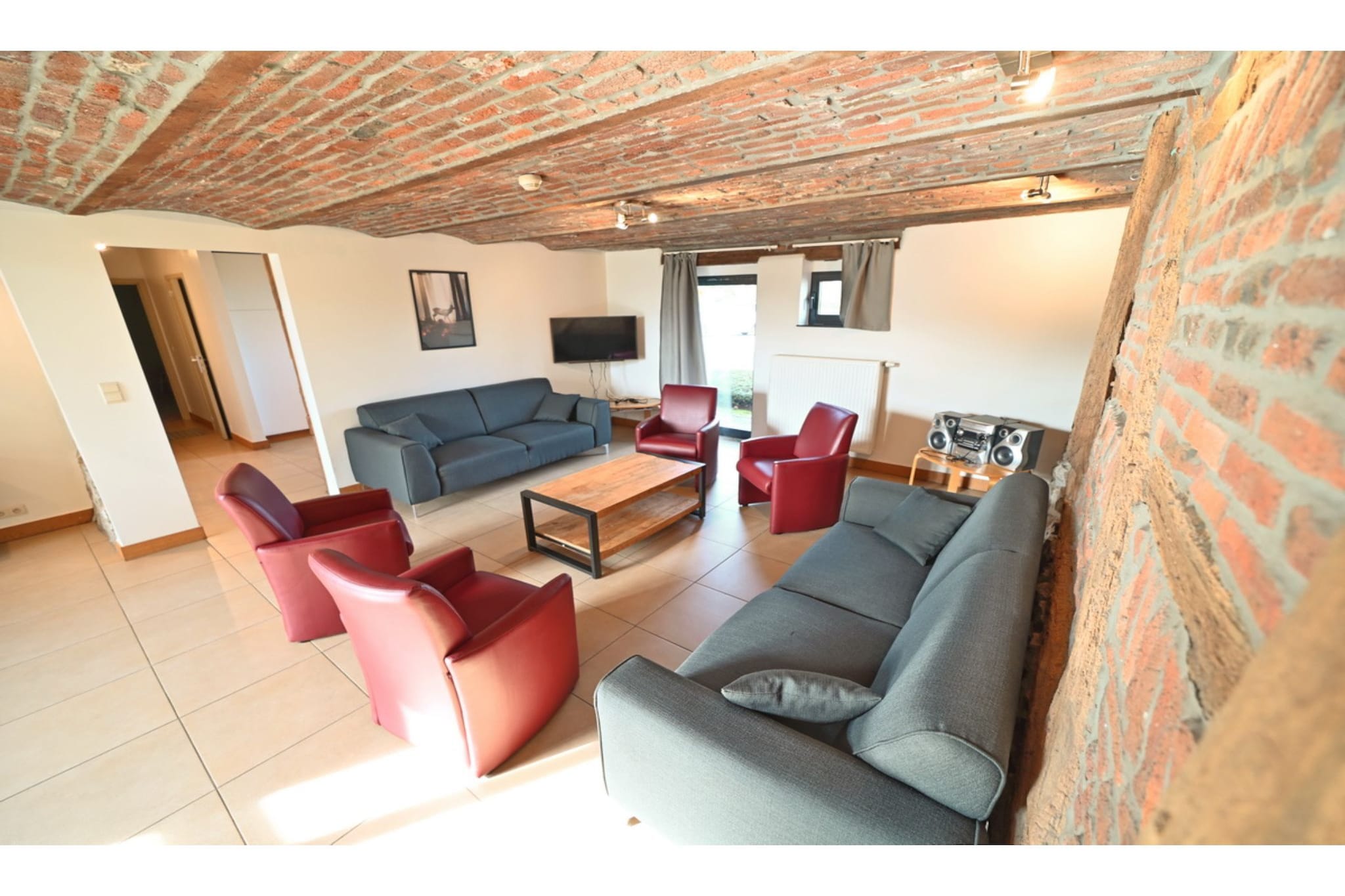 Perfect to bring together family and friends for a get-together, this is a 6-bedroom holiday home in Durbuy. It comes with a lovely furnished garden where you can enjoy barbecued meals in the evenings. A total of 14 persons can stay here.

Located on the banks of the Ourthe, this place is perfect for food lovers. You can also enjoy walking, mountain biking, or exploring the forest on horseback. The dolmen and menhir of WÃ©ris and the Caves of Hotton are nearby to visit.

The holiday home has central heating for comfort during colder seasons. In the living room, you can watch movies together at night. The garden invites you to enjoy the hours of sunshine and relax in the fresh air. In the mezzanine, there is a double sofa bed to lounge on while reading a new book. A cot and a high chair can be rented here.

Bachelor parties, youth groups, night noise and loud noises during the day are not allowed due to the central location in the village.