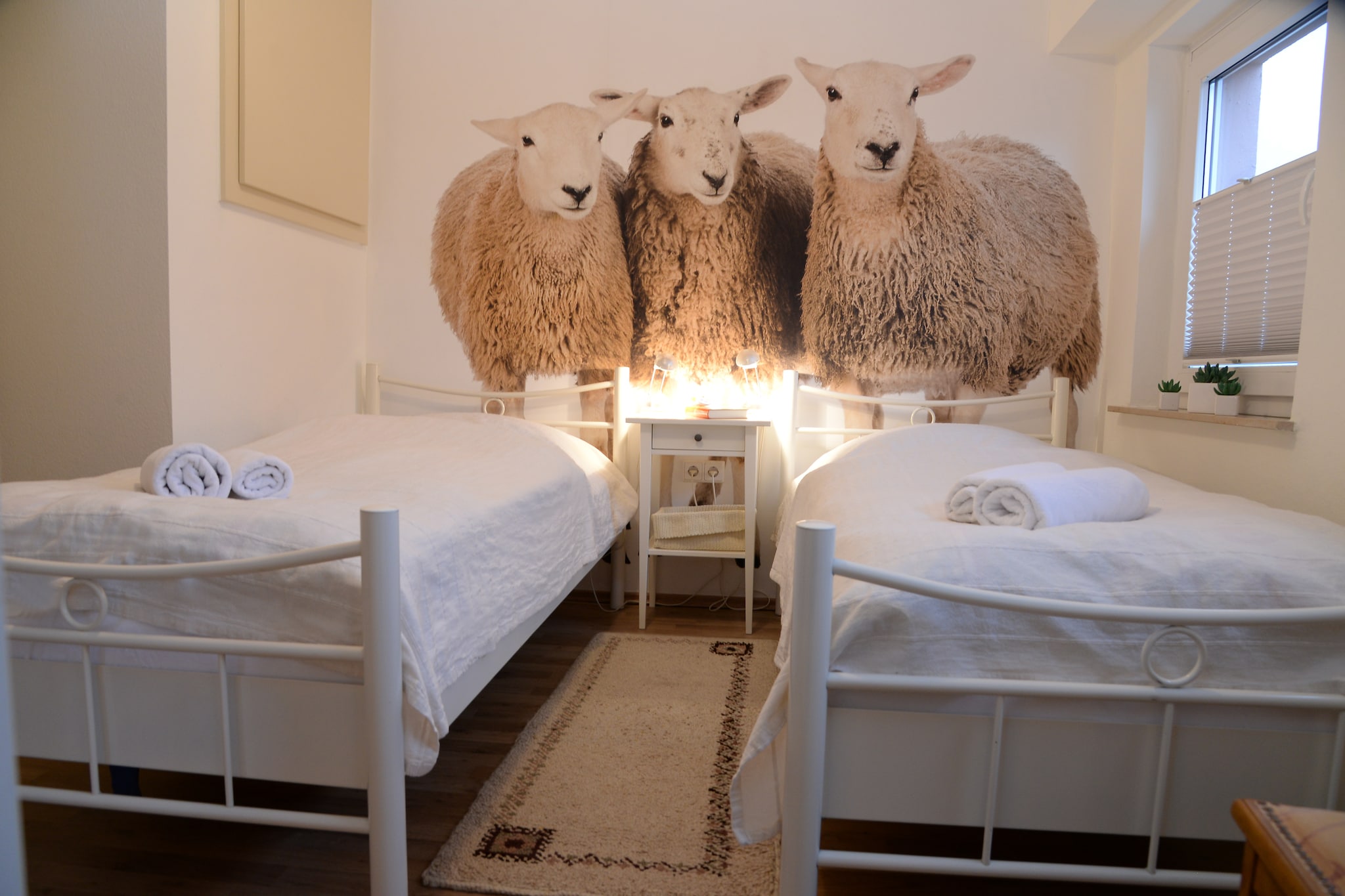 Ground floor: (Entrance, hall, Large kitchen(electric kettle, toaster, cooker(4 ring stoves, ceramic), coffee machine(filter), oven, waffle iron, microwave, dishwasher, fridge(+ freezer)), Living/diningroom(TV(satellite), DVD player, radio, CD player, stereo unit), bedroom(single bed, single bed), bedroom(single bed, single bed), bathroom(shower, washbasin, toilet), bathroom(bath tub, washbasin, toilet, hairdryer), toilet(washbasin))\n\nstorage(washing machine), cot, sauna(4 persons), heating(central), terrace(12 m2), terrace(private, 16 m2), garden(private, partially fenced, 400 m2), garden furniture, BBQ(charcoal), parking, deckchairs, parasol, high chair, ironing board, iron, awning, party games, toys, insect screens