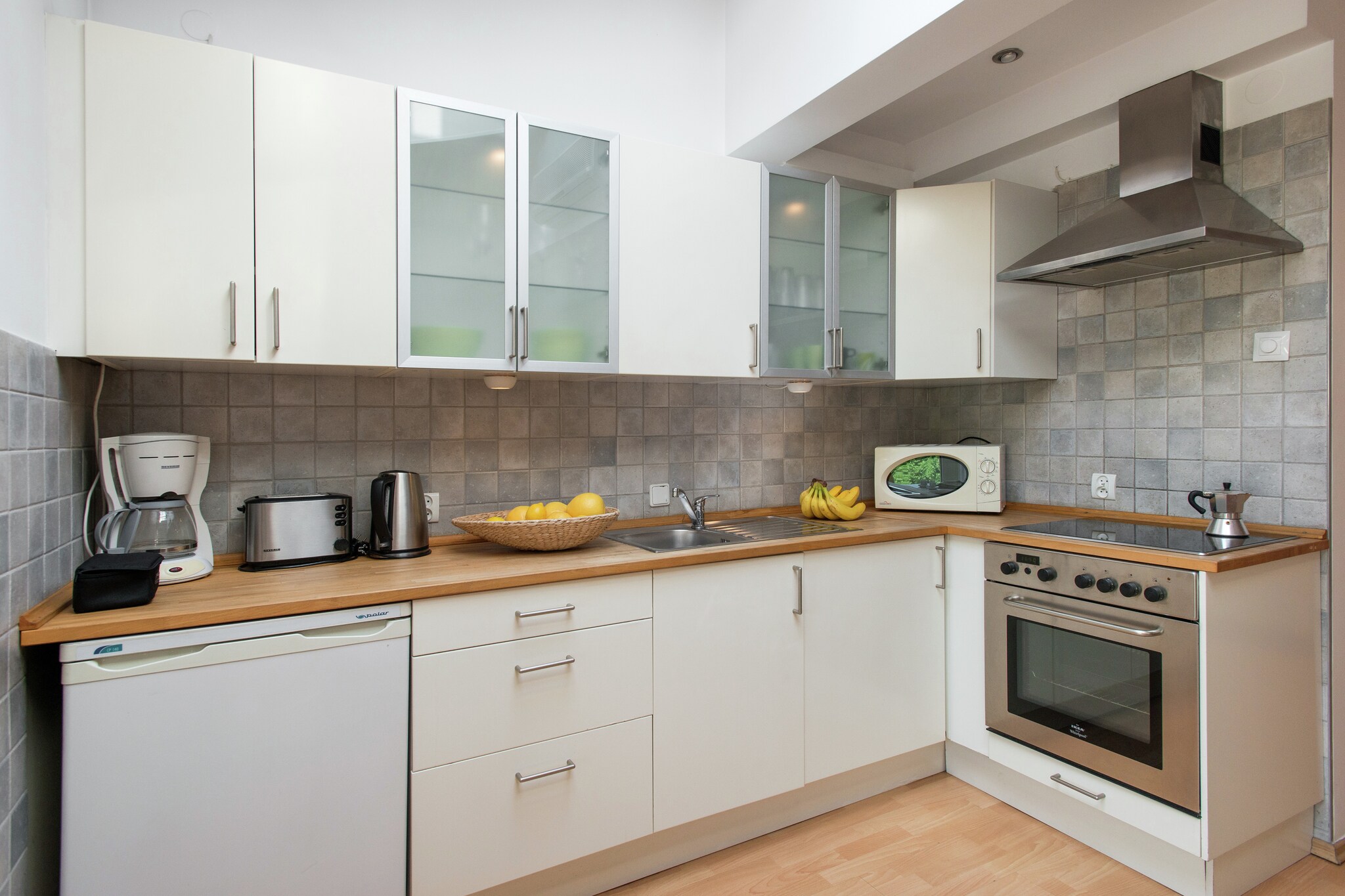 On the 3rd floor: (air conditioning)\n\nopen kitchen(cooker(ceramic), oven, microwave, fridge-freezer), Living/diningroom(single sofa bed), bedroom(small double bed), bathroom(shower, washbasin, toilet, washing machine), mezzanine, radio, children\'s bed(on request), high chair(on request)