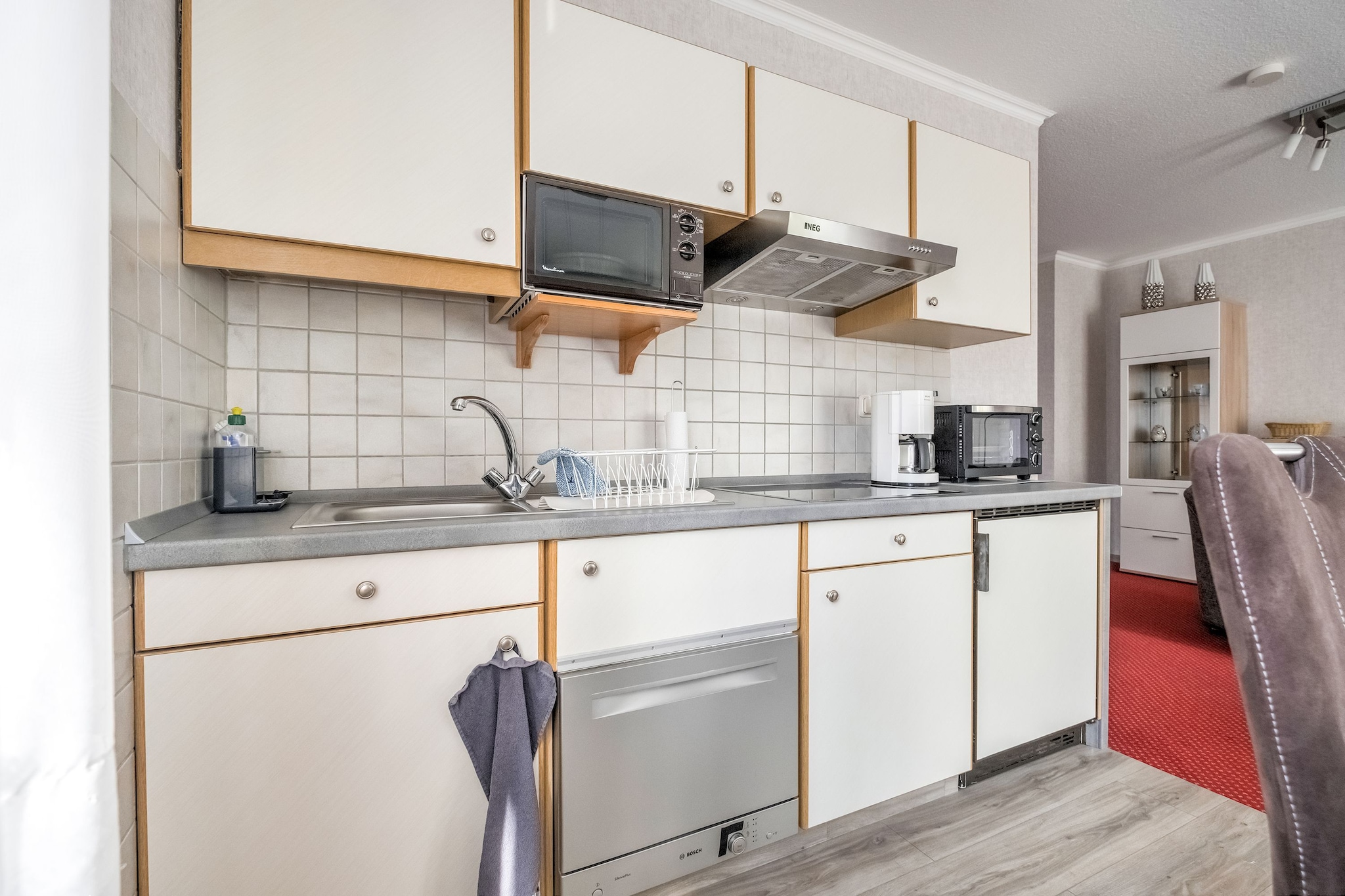 On the 1st floor: (open kitchen(dining table, cooker(ceramic), coffee machine, microwave, dishwasher, fridge-freezer), Living/diningroom(single sofa bed, TV(satellite), radio), bedroom(double bed(180 x 200 cm), TV(satellite)), bedroom(single bed, single bed), bathroom(shower, washbasin, toilet))\n\nstorage, tumble dryer(shared with other guests, paid), balcony, heating(central), garden(shared with other guests), garden furniture, parking, table tennis table, children\'s bed, high chair, Charging post for electric cars