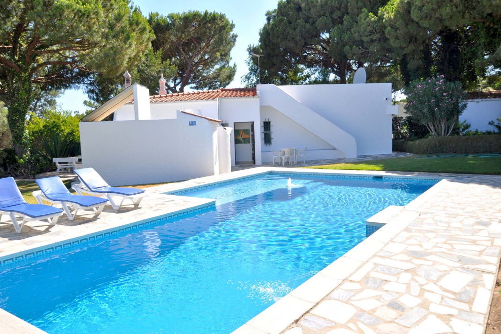 Located in the old village of Vilamoura in Loulé, this airy villa has 4 bedrooms for 2 people. Equipped with a swimming pool and free WiFi, this villa is a comfortable stay amidst natural surroundings. This child-friendly abode is perfect for a small family with kids.In the immediate vicinity of Vilamoura, you can enjoy four golf courses, a game of tennis, lawn bowling greens, shooting, riding, sailing, deep-sea fishing, water sports, cycling, football, squash, minigolf, or just walking. You can visit the town center, 1.8 km away and experience local nightlife there. The beach is located at a distance of 2.3 km. The kitchen is well-equipped with amenities including oven, microwave, dishwasher and refrigerator. Guests can enjoy a hot barbecue in the garden or by the swimming pool. You can light up the fireplace. The twin bedrooms and a double bedroom on the first-floor featuring ensuite bathrooms with bathtubs and air-conditioning. A tumble dryer and washing machine are also available.
About Belvilla
When you stay in a Belvilla home, you can rest assured of a unique holiday home in ideal surroundings at an attractive price. The portfolio of accommodations consists of more than 40,000-holiday homes in 20 European countries. Interested in a weekend getaway, a summer or winter sports holiday or simply a short break? Do you prefer the coast, the countryside or the mountains? Whatever your preference, there is a Belvilla home to meet your needs, from a cosy gîte for two to a castle big enough for the entire family, from an apartment in the heart of Rome to a cabin in the middle of nowhere, from a simple tree house to a luxury dream villa and from close to home to the other side of Europe.
A Belvilla home gives you the freedom to enjoy breakfast in your pyjamas or continue a good conversation into the morning hours without having to worry about the bar's closing time. Prepare gourmet meals with fresh local ingredients in your own kitchen and take advantage of having your own swimming pool to do as many cannonballs as you want! In other words, you can enjoy complete privacy in your home away from home.