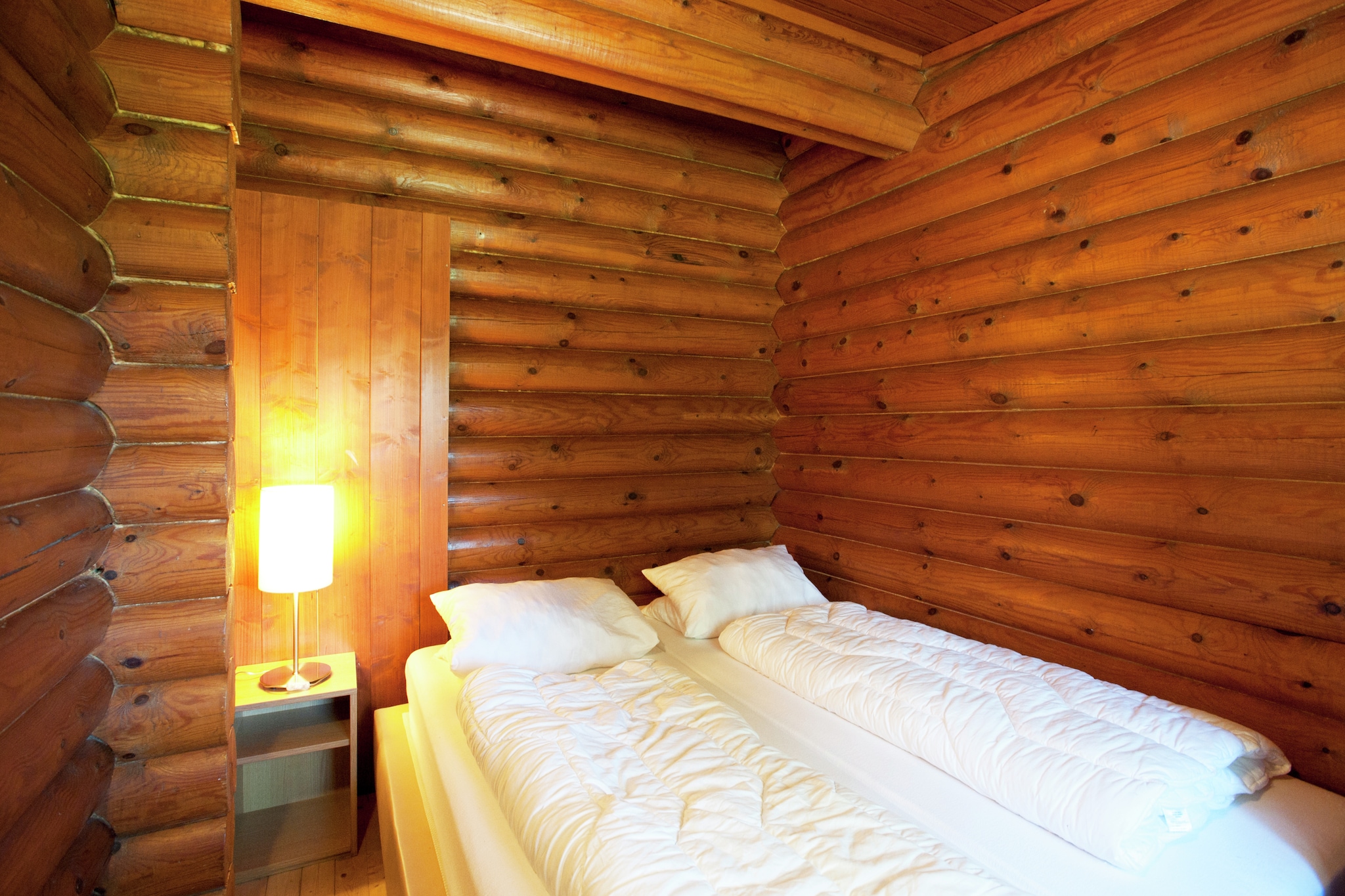 Ground floor: (hallway, Living room(TV(satellite), seating area, radio), open kitchen(cooker, coffee machine, oven), bedroom(double bed), bedroom(2x single bed), bedroom(bunk bed), bathroom(shower, washbasin, toilet, heating))\n\nheating(central), terrace(private), garden(private), garden furniture, BBQ, parking, high chair