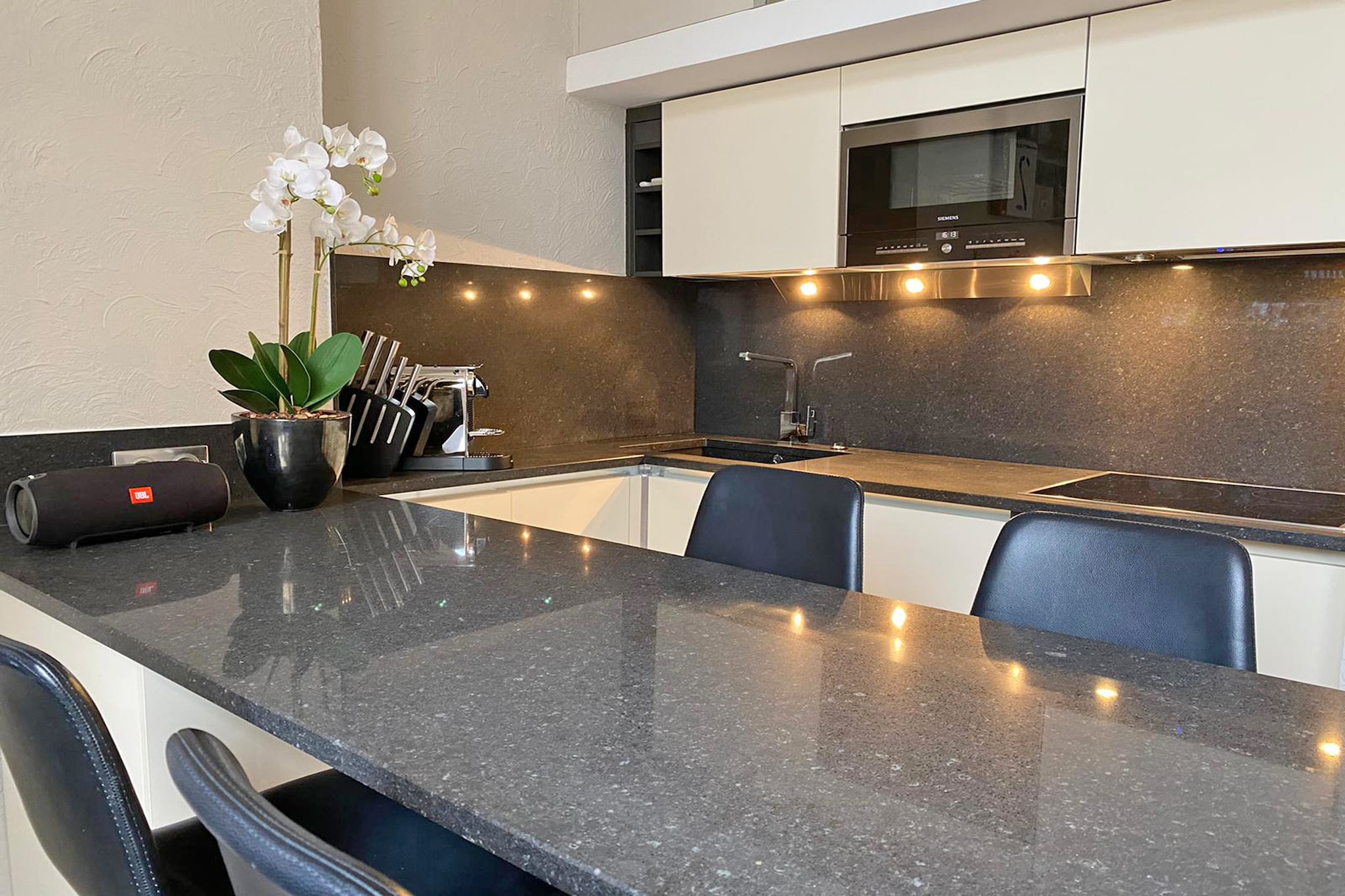 On the 1st floor: (open kitchen(electric kettle, cooker(ceramic), hood, coffee machine(cups), combination microwave, dishwasher, fridge-freezer), Living/diningroom(TV(flatscreen, smart TV), seating area, wireless music system, streamingservice), bedroom(small double bed(120 x 190 cm), heating), Gallery bedroom(double king size bed(180 x 200 cm), TV(flatscreen), DVD player, radio, CD player), bathroom(bathtub with shower, washbasin, toilet, heating), balcony, air conditioning, garden furniture)\n\nparking, swimming pool(shared with other guests, fenced, 12 x  7 m., opened from 1/2 Apr upto and including Nov)