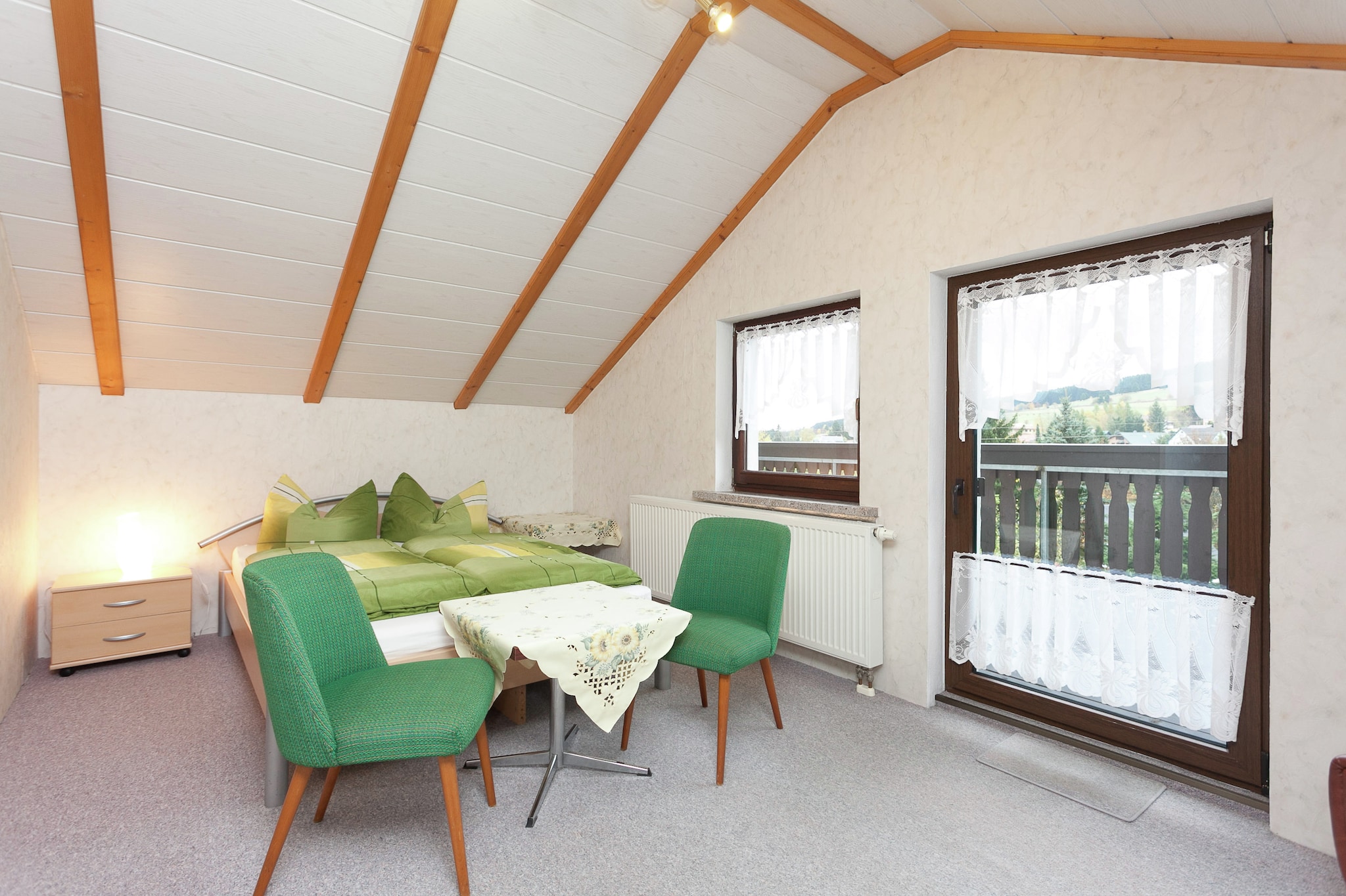 Ground floor: (Entrance, hall, Kitchen(hob(2 ring stoves, electric), toaster, coffee machine(filter), microwave, fridge(+ freezer)), Living/diningroom(TV(digital), dining table, DVD player, radio, stereo unit), bathroom(shower, washbasin, toilet))\n\nOn the 1st floor: (bedroom(double bed(140 x 200 cm)), bedroom(double bed(180 x 200 cm)))\n\ncot, balcony, heating(central), terrace(private), garden(private, partially fenced), garden furniture, BBQ, parking, deckchairs, parasol