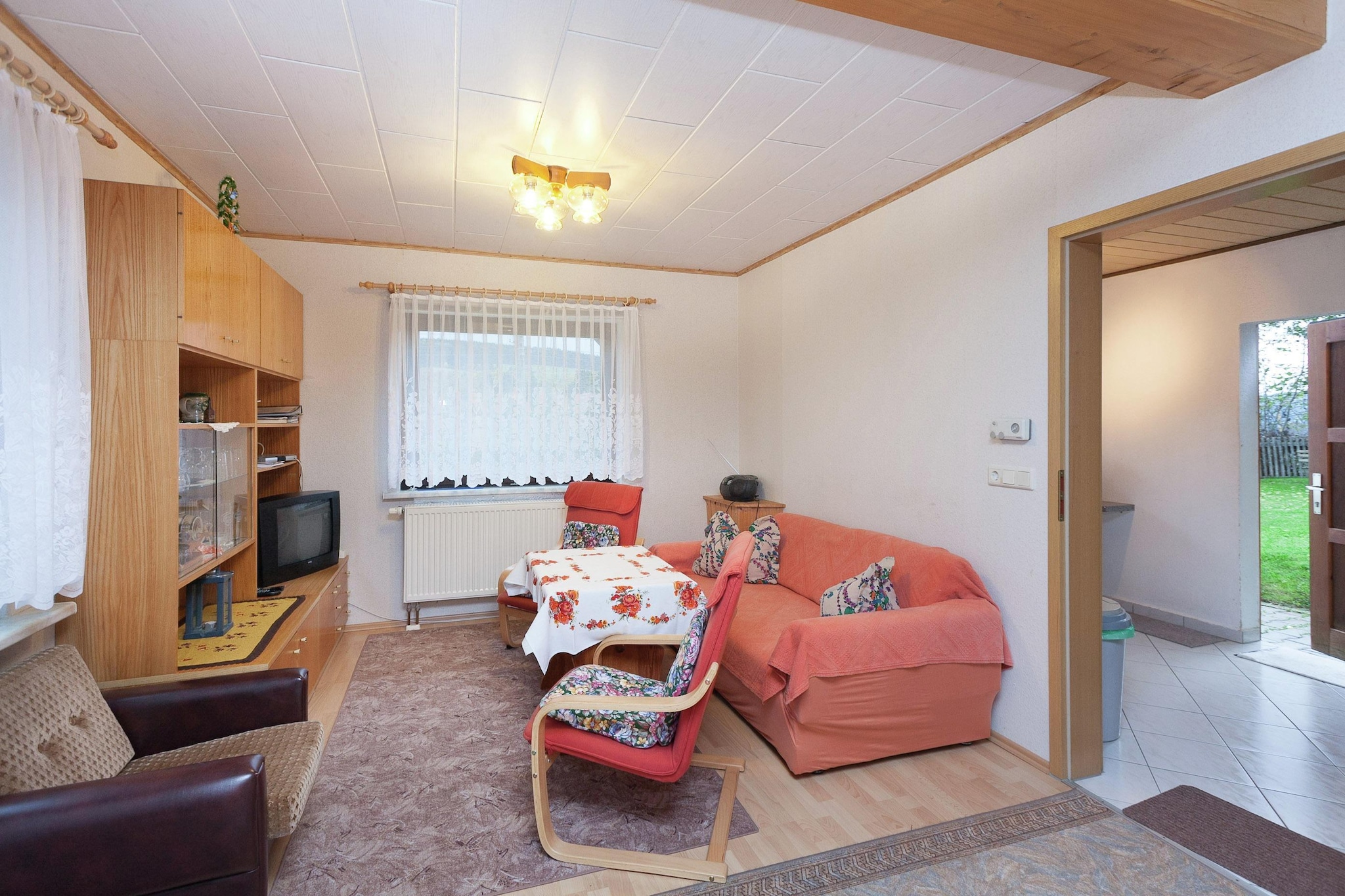 Scenic Forest Retreat
Experience serenity in this 2-bedroom holiday home in Altenfeld, offering panoramic views of colorful forest meadows and wooded mountains. Ideal for a small family, the home features a fully equipped kitchen, a cozy living and dining area with a TV and DVD player, and central heating for year-round comfort. Step outside to the private terrace or garden, furnished for relaxing afternoons and evening barbecues.
Nature & Outdoor Activities
Surrounded by the Thuringian Forest, this location is perfect for hiking along the Rennsteig or Schwarzatal trails. Winter brings opportunities for cross-country skiing, downhill skiing, and tobogganing, while summer invites forest walks and picnics. The peaceful environment ensures quiet moments after an active day, making it a refreshing escape from everyday routines.
Dining & Nearby Attractions
Restaurants and public transport are just 0.3 km away, with supermarkets at 3 km for convenient self-catering. Excursions to the cultural cities of Erfurt and Weimar are ideal for day trips. The private terrace and partially fenced garden allow for outdoor meals or sunbathing, while on-site parking provides added convenience. This holiday home combines comfort, natural beauty, and accessibility, creating a memorable stay in the Thuringian Forest.