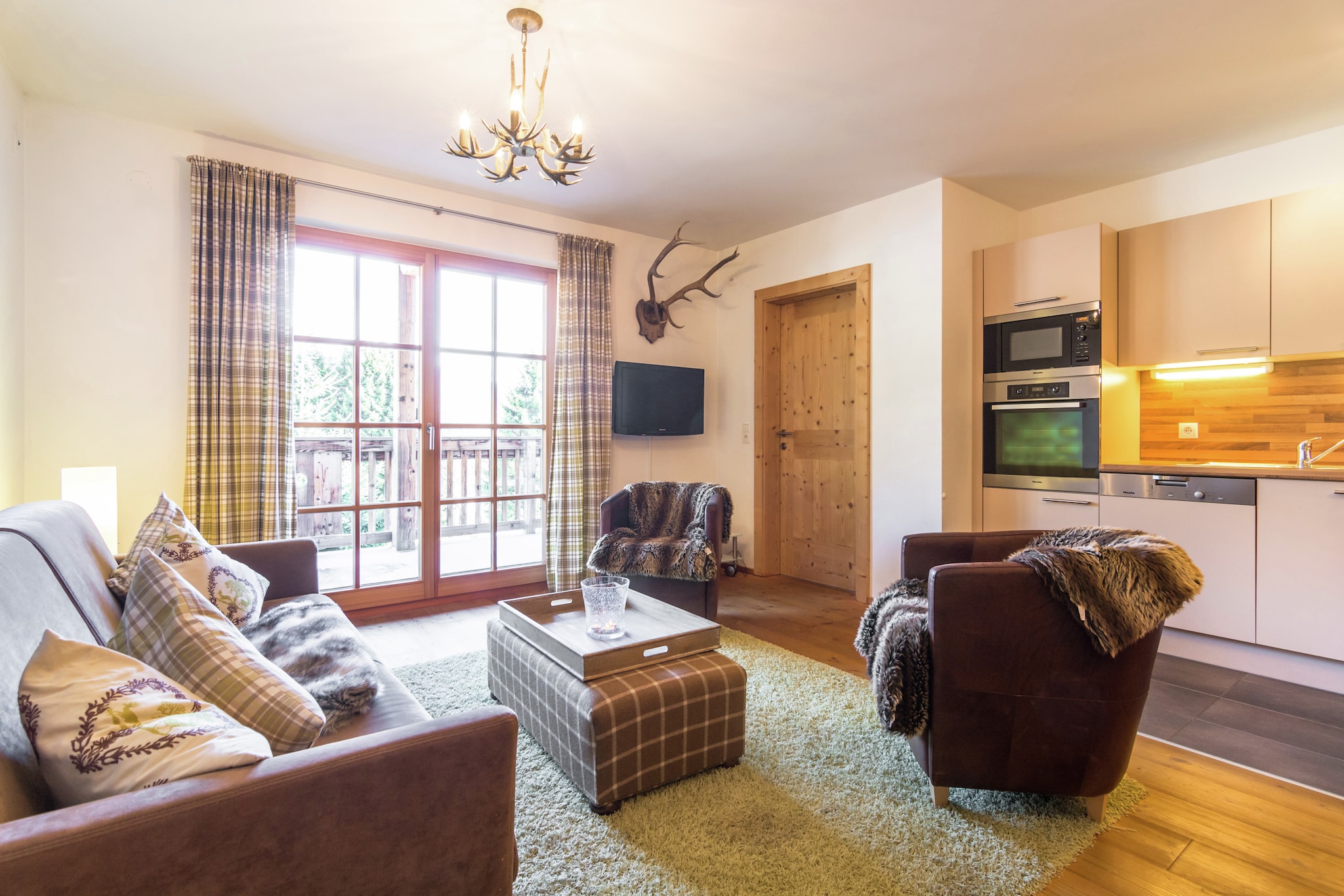 Ground floor: (Living room(double sofa bed, TV(satellite), stove, CD player), open kitchen(oven, microwave, dishwasher), bedroom(double bed), bedroom(double bed), bedroom(bunk bed), bathroom(bath tub, shower), bathroom(shower, 2x washbasin, toilet), toilet)\n\nski storage(ski boot heaters), garage, heating(central), terrace, garden(shared with other guests), garden furniture, parking, lift, children\'s bed, high chair