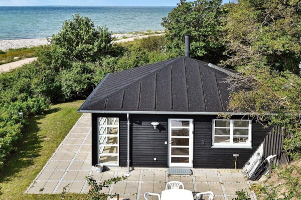 4-persoons vakantiehuis aan zee in Martofte met panoramisch uitzicht - thumbnail 1