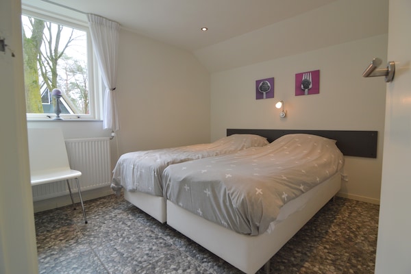 Knusse bosbungalow in Stramproy met terras aan de vijver - thumbnail 2