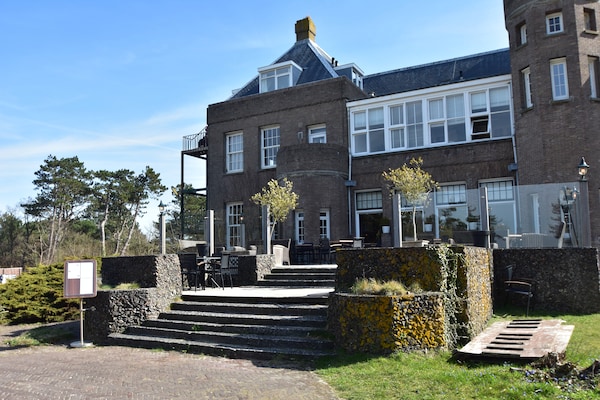 Huize Glory Turkoois: comfortabel vakantiehuis tussen bos en duinen - thumbnail 1