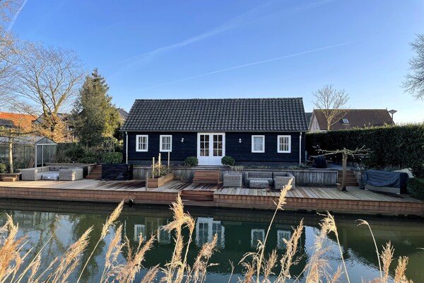 Duurzaam vakantiehuis aan water in Cothen met luxe terras - thumbnail 1