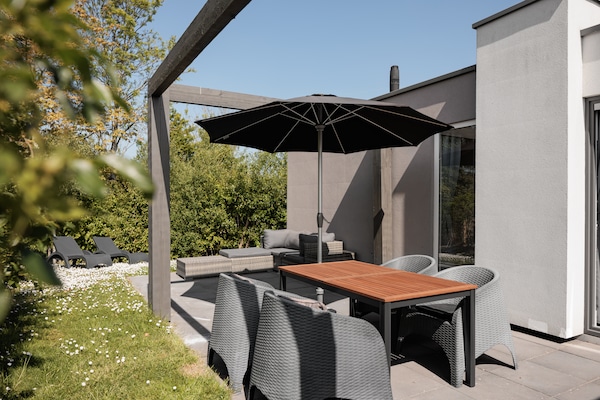 Modern vakantiehuis aan de Zeeuwse kust met tuin nabij strand - thumbnail 4