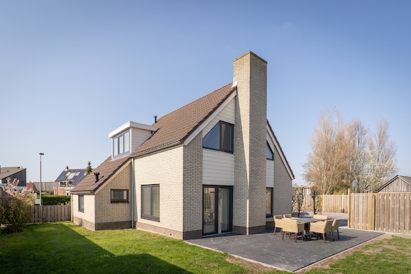 Moderne bosbungalow voor 6 personen op Texel, nabij golfbaan en strand - thumbnail 1