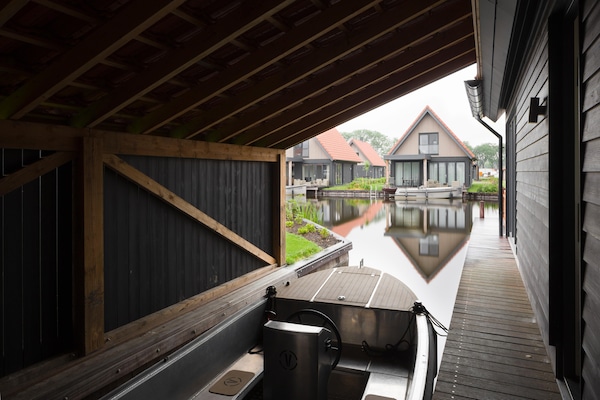 Luxe watervilla in Nationaal Park Weerribben-Wieden met privéboot - thumbnail 6