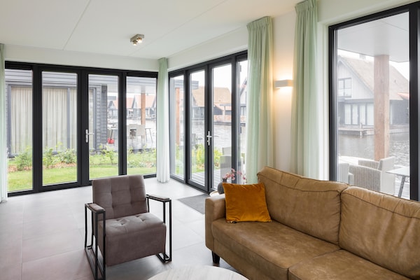 Luxe vrijstaande watervilla met eigen aanlegsteiger in Ossenzijl - thumbnail 6