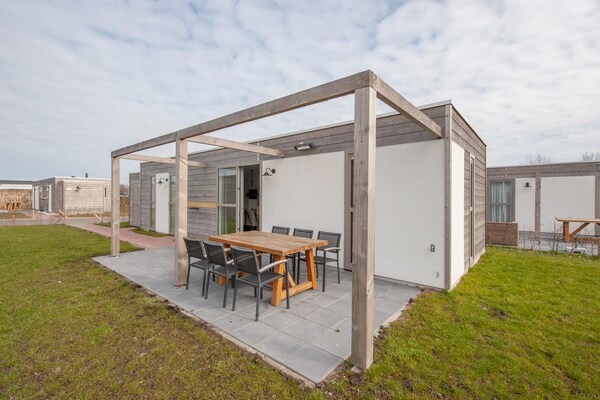 Stijlvolle lodge aan zee in Nieuwvliet-Bad met tuin en huisdierenvriendelijk - thumbnail 1