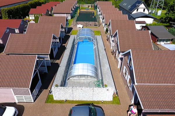 Gezinsbungalow met verwarmd zwembad op 850 meter van het strand in Miedzyzdroje - thumbnail 2