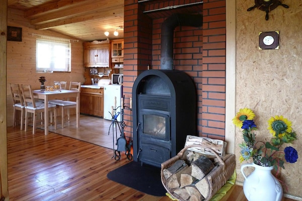 Knus houten vakantiehuis met open haard en tuin nabij meer in Dobrogoszcz - thumbnail 4