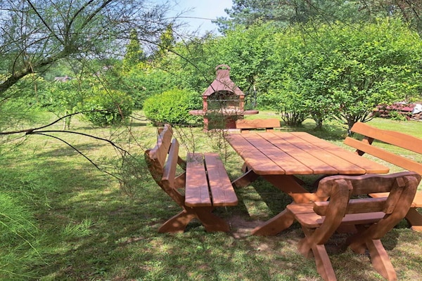 Knus houten vakantiehuis met open haard en tuin nabij meer in Dobrogoszcz - thumbnail 3