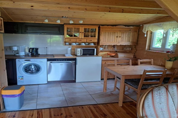 Knus houten vakantiehuis met open haard en tuin nabij meer in Dobrogoszcz - thumbnail 6