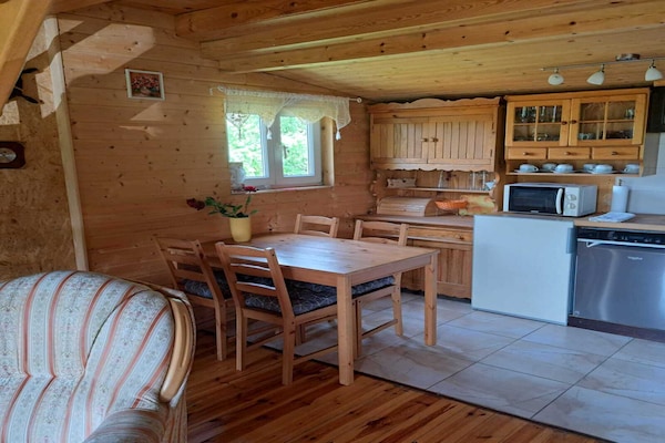 Knus houten vakantiehuis met open haard en tuin nabij meer in Dobrogoszcz - thumbnail 5
