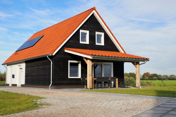 De Ooievaar: Luxe vrijstaand vakantiehuis aan Nationaal Park Oosterschelde - thumbnail 1