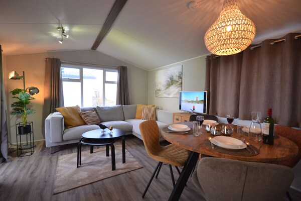 Wiringher Chalet 83: Vrijstaand chalet aan Waddenzee met hond, tuin en strand - thumbnail 2