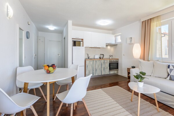 Zonsondergang appartement met balkon en panoramisch zeezicht in Postira - thumbnail 6