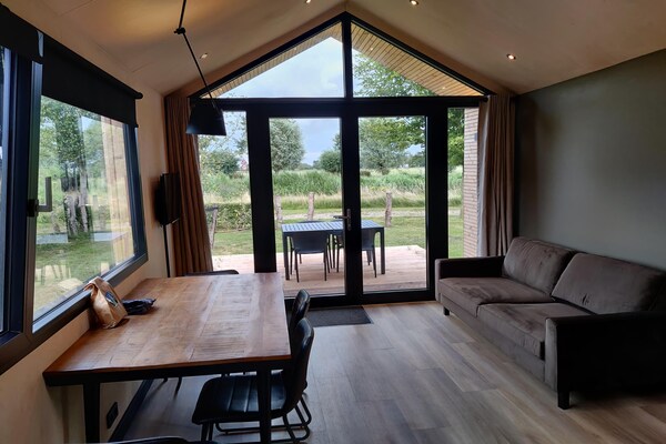 Knus chalet in Flevoland met tuin, tennisbaan en wandelingen in Kuinderbos - thumbnail 6