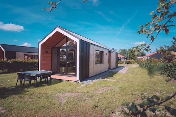 Knus chalet in Flevoland met tuin, tennisbaan en wandelingen in Kuinderbos - thumbnail 2