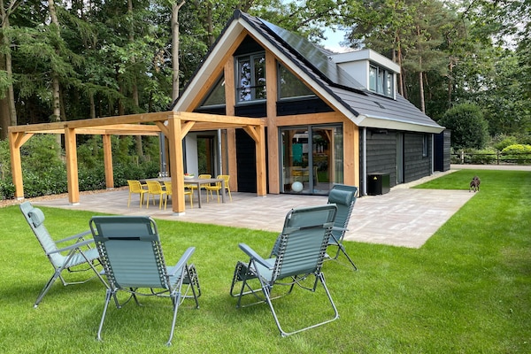 Boschhuis Boucle: vrijstaand vakantiehuis met uitzicht op water in Lochem - thumbnail 1