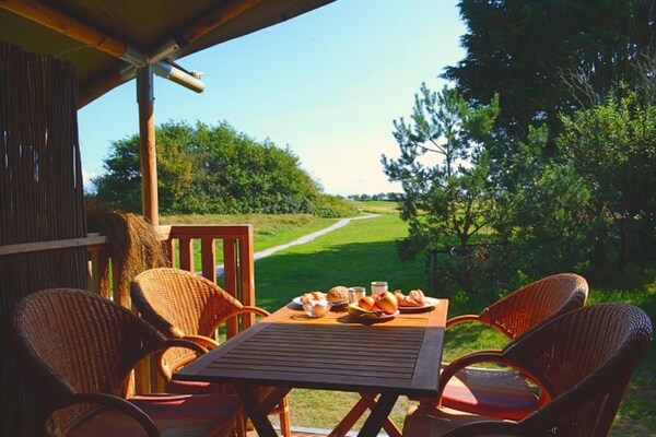 Luxe safaritent met uitzicht op golfbaan, dichtbij strand Hollum - thumbnail 2