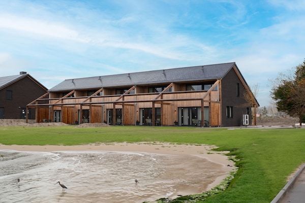 Modern vakantiehuis aan de kreek, 1,2 km van zee in Resort Nieuwvliet-Bad - thumbnail 1