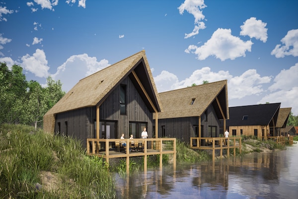 Luxe vakantievilla aan water in Resort Nieuwvliet-Bad, 1,2 km van zee - thumbnail 1