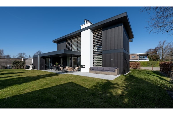 Modern vakantiehuis met buitenhaard aan Veerse Meer in Kamperland - thumbnail 2