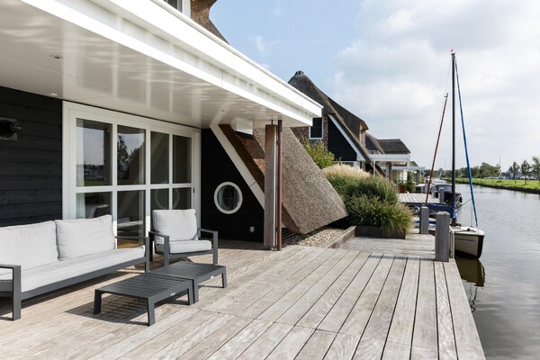 Luxe villa aan het Tjeukemeer met steiger en huisdierenvriendelijke omgeving - thumbnail 6