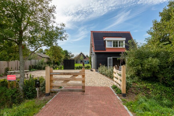 Het Koetshuys: charmant appartement op loopafstand van het Zoutelandse strand - thumbnail 1
