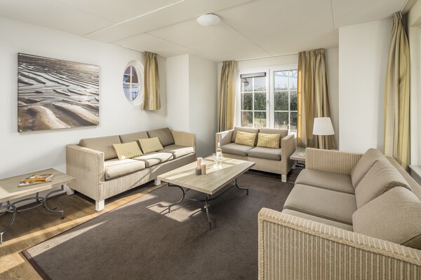 Luxe watervilla met aanlegsteiger op 400m van Noordzee-strand - thumbnail 2