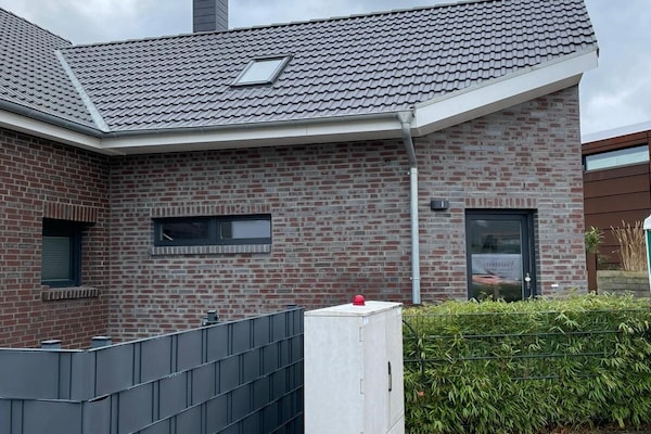 Zongericht appartement met omheinde tuin bij golf en strand - thumbnail 1