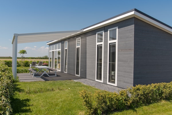 Modern vakantiehuis aan de Oosterschelde in rustig park - thumbnail 6