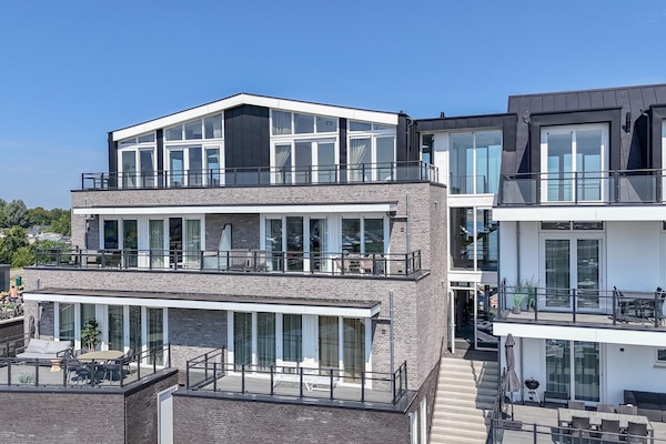Vista Maris: Luxe appartement met panoramisch zeezicht in Sint-Annaland - thumbnail 1