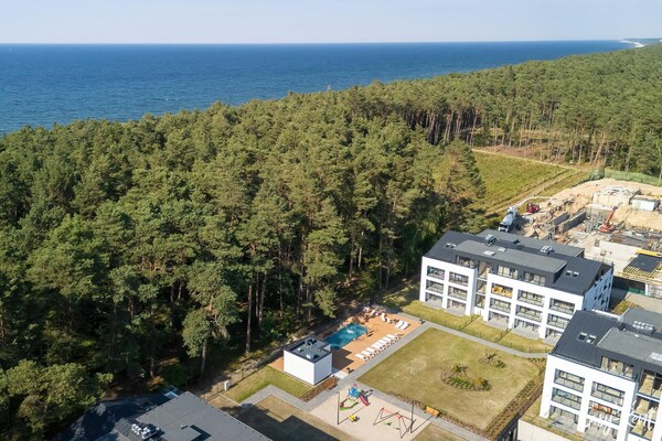 Lichte studio op 300m van strand met zwembad en balkon in Łukęcin - thumbnail 1