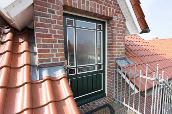 Stijlvol appartement Pilsum aan het water in Greetsiel met sauna en roeiboten - thumbnail 1