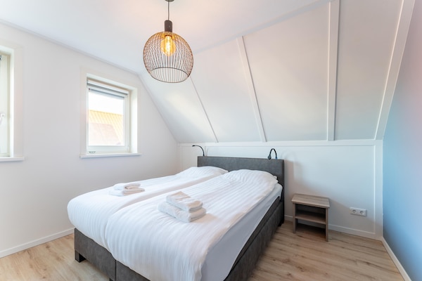 Vrijstaande wellnessvilla in Scherpenisse met weids uitzicht en strand op 300m - thumbnail 5