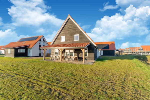 Vrijstaande wellnessvilla in Scherpenisse met weids uitzicht en strand op 300m - thumbnail 4