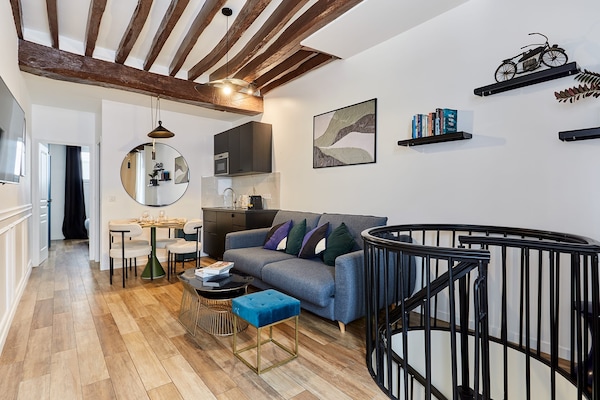 Licht appartement op de begane grond in de levendige 9e arrondissement van Parijs - thumbnail 2