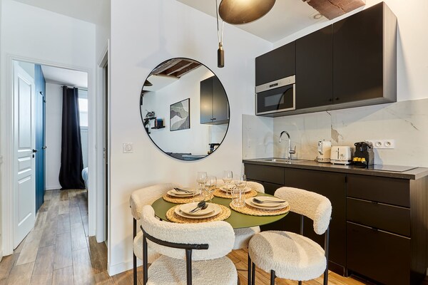 Licht appartement op de begane grond in de levendige 9e arrondissement van Parijs - thumbnail 6