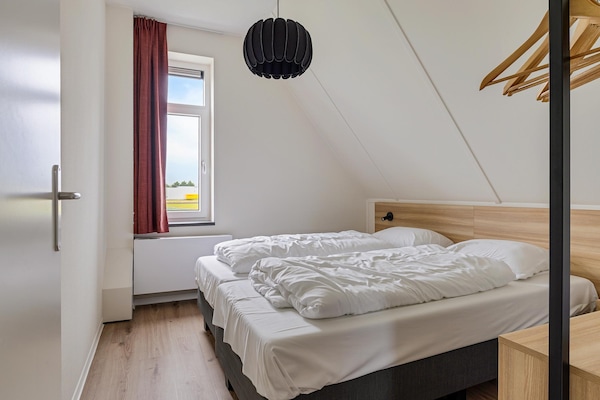 Vrijstaand watervilla Koggehuys met aanlegsteiger op Dormio Resort Medemblik - thumbnail 5