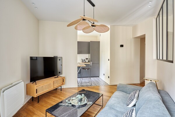 Modern appartement in Haussmann-pand midden in Parijs - thumbnail 2